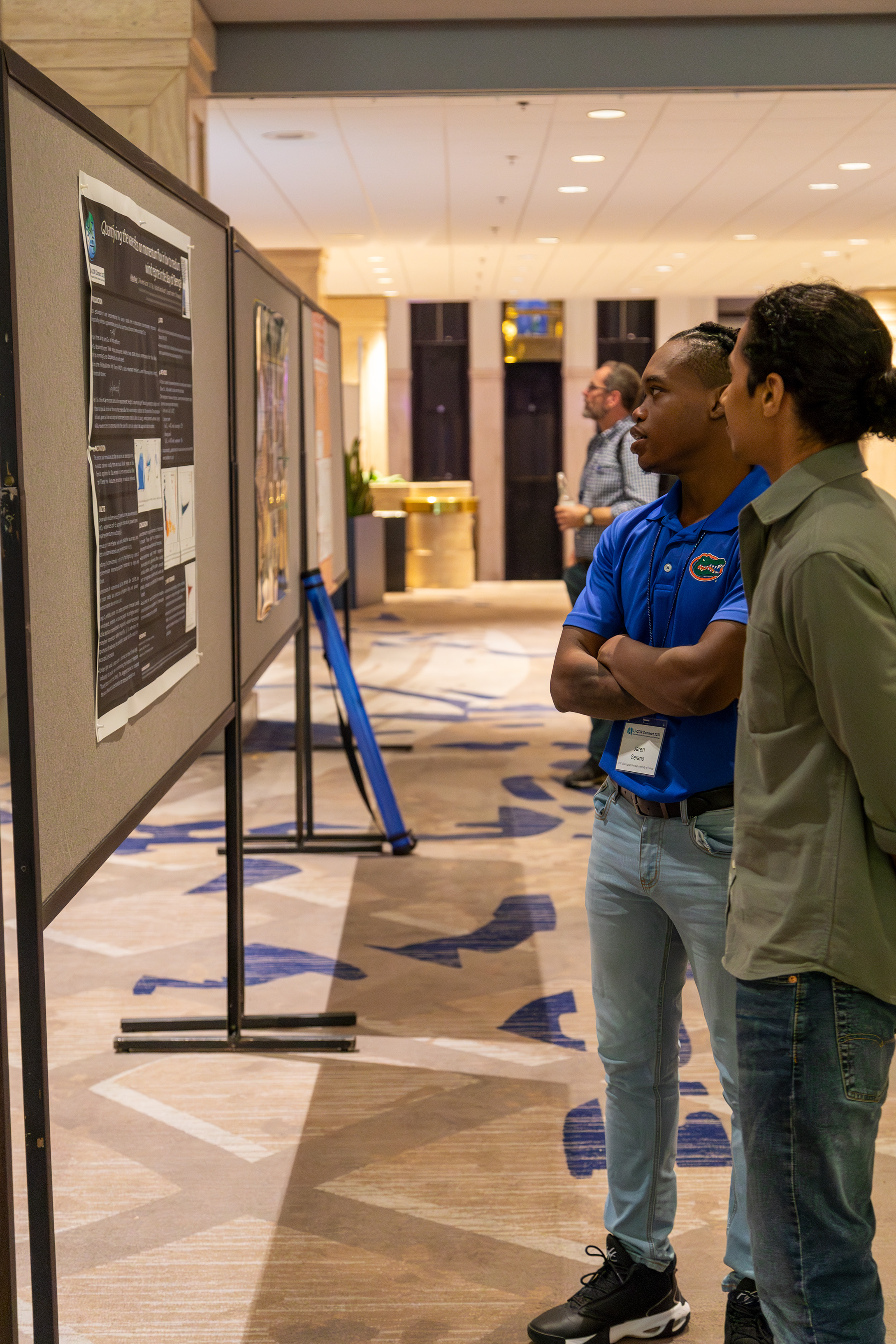 Attendees discussing posters during poster session at LI-COR Connect 2023